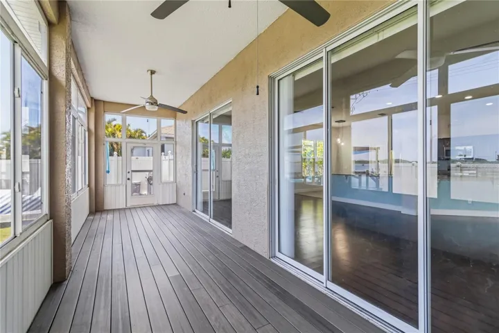 Long screened sunroom overlooking backyard