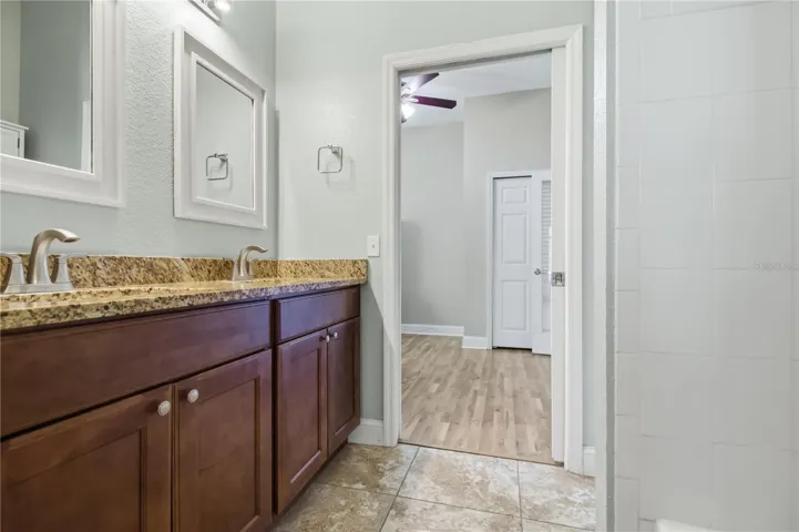Guest bath with vanity and tub nearby