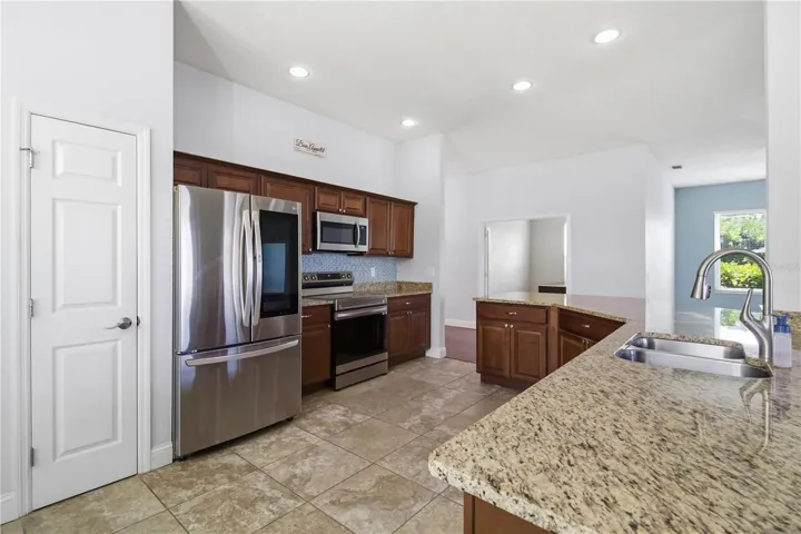 Open kitchen with wraparound breakfast bar