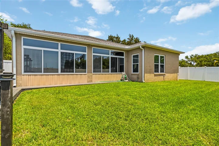 Rear exterior with screened sunroom