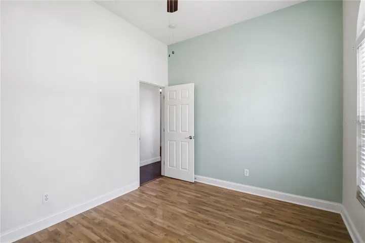 Secondary bedroom with accent wall