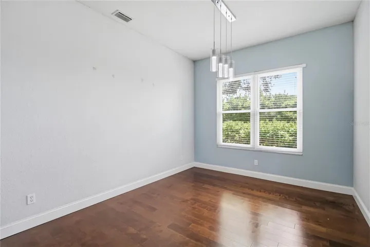 Spacious primary suite with backyard views