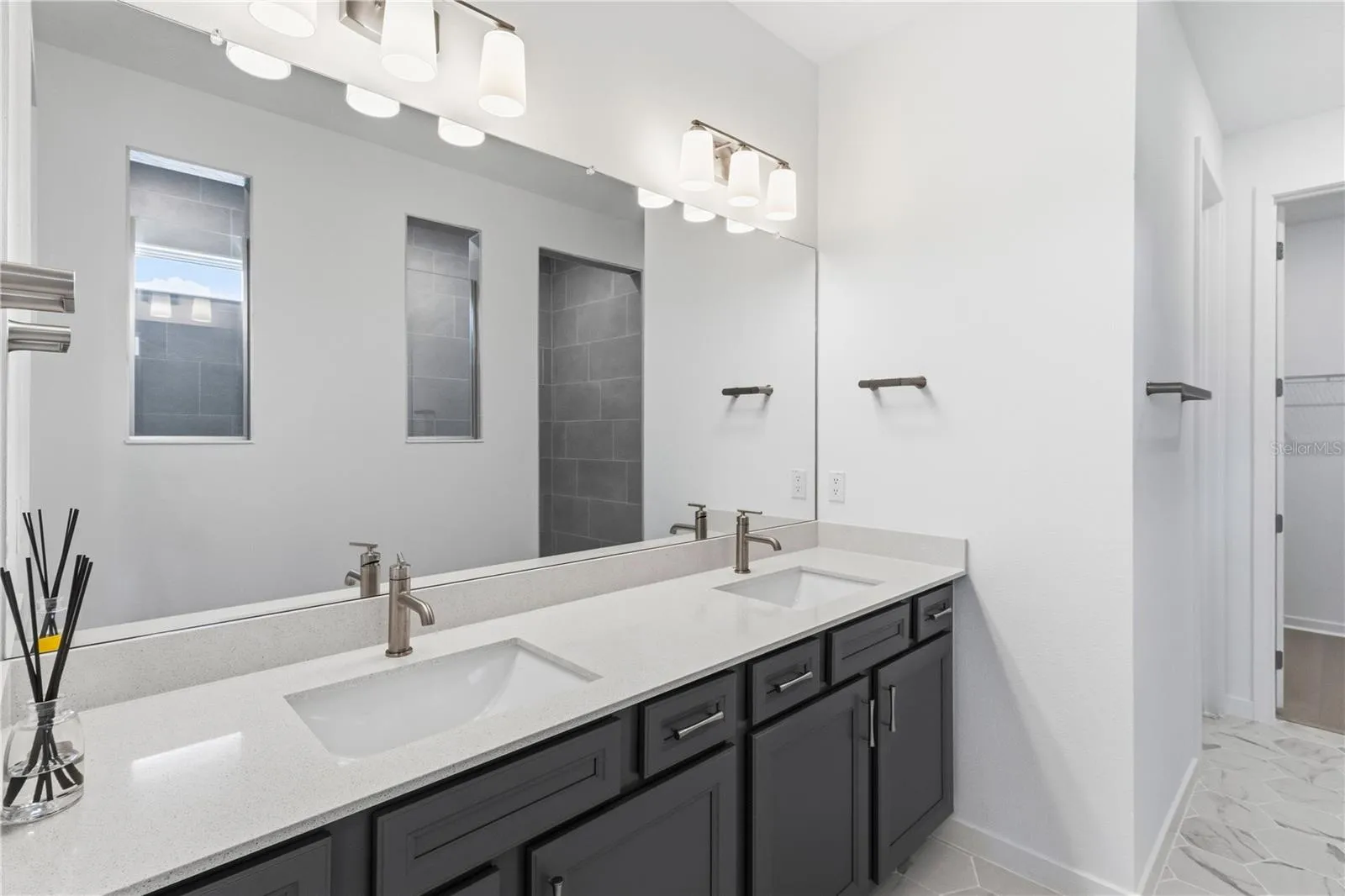 Beautiful primary bath with dual sinks, upgraded finishes, and everyday convenience.