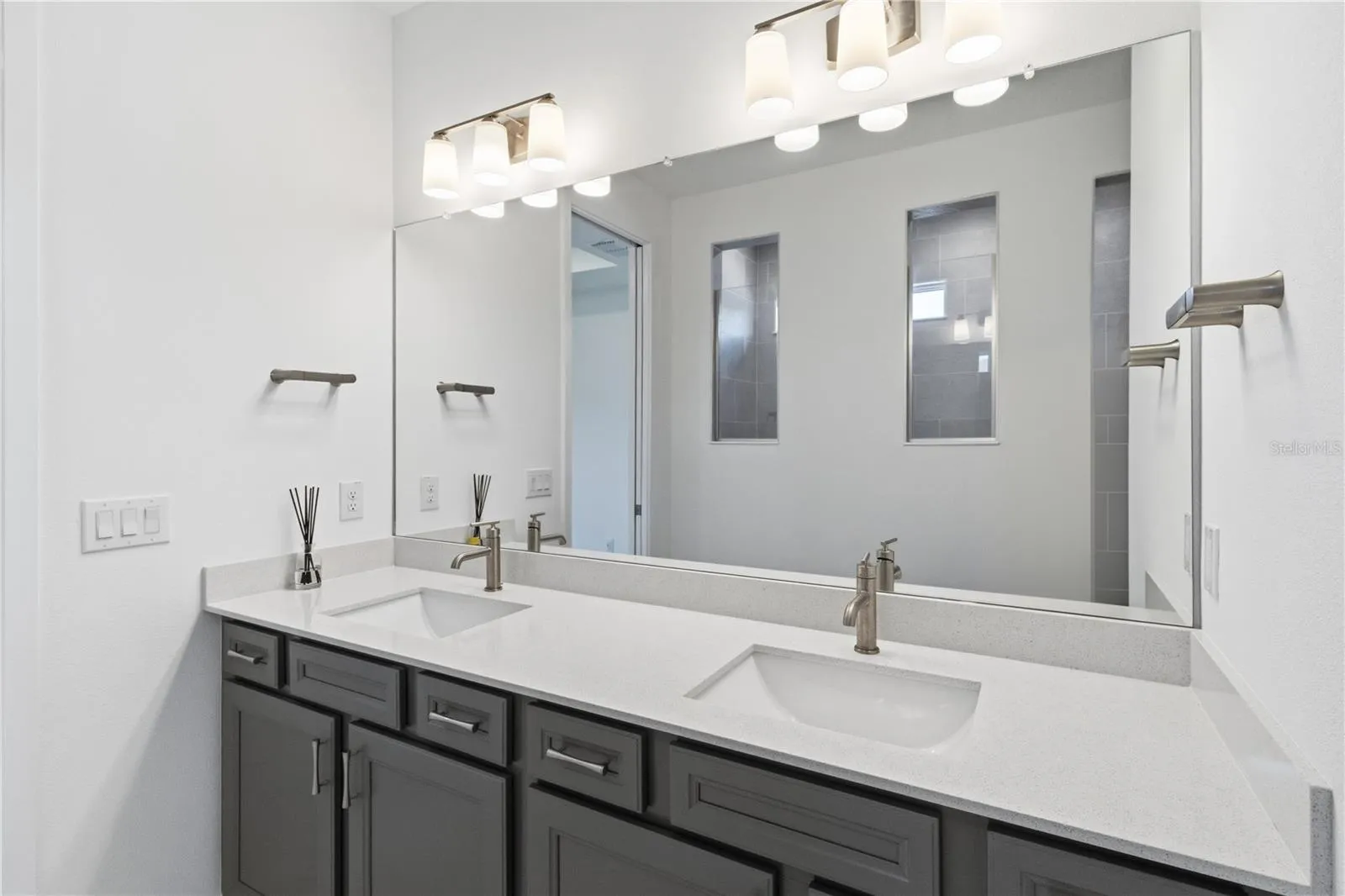 Beautiful primary bath with dual sinks, upgraded finishes, and everyday convenience.