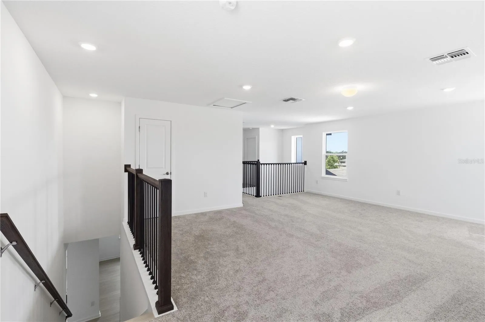 Bright loft area with room to create a media space, play area, homework zone, or lounge.
