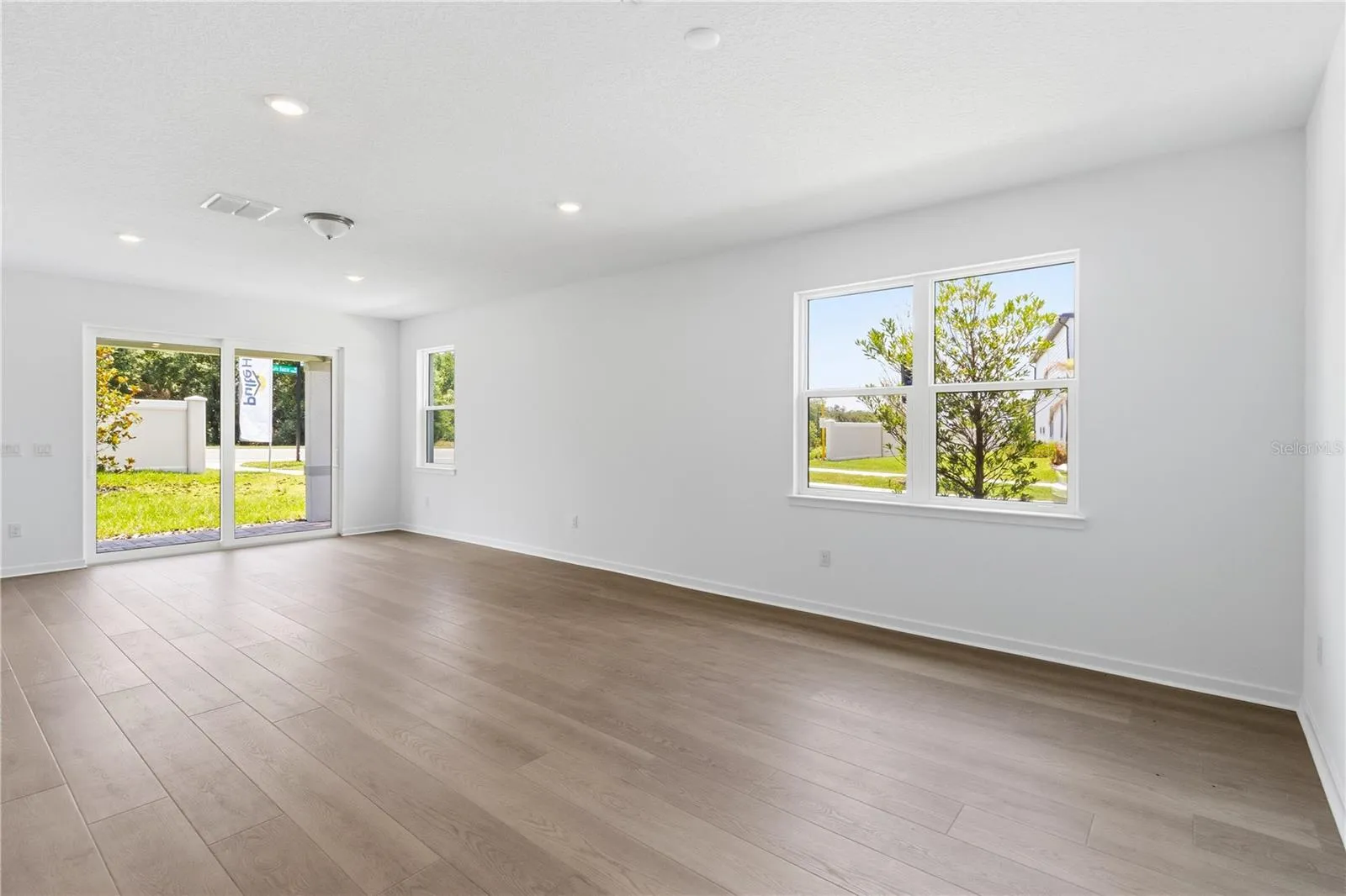 Open gathering room with natural light and flexible space for everyday living.