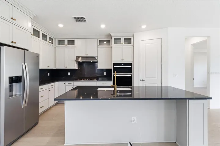 Open kitchen and gathering space designed for meals, conversation, and connection.
