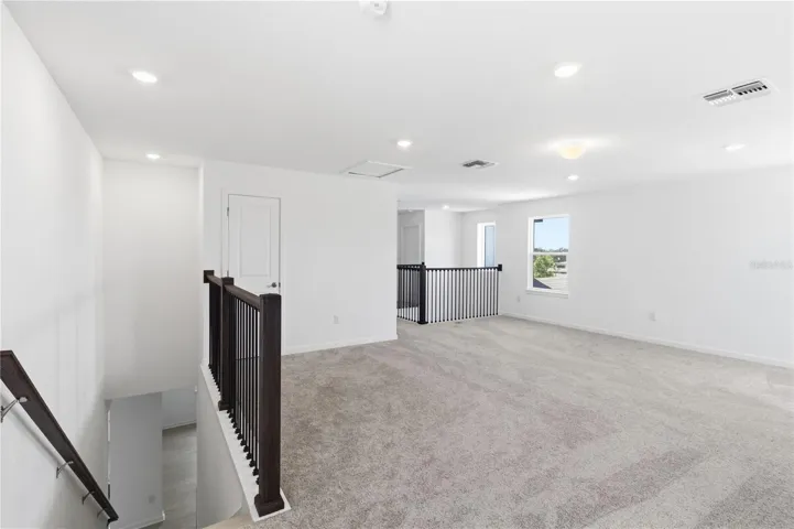 Bright loft area with room to create a media space, play area, homework zone, or lounge.