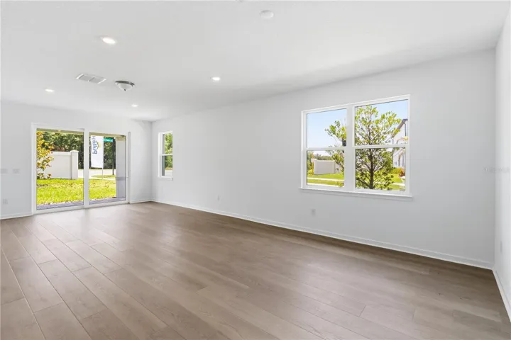 Open gathering room with natural light and flexible space for everyday living.