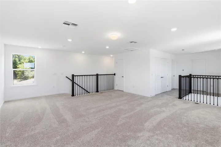 Large upstairs loft with open sightlines and flexible space for a second living area.