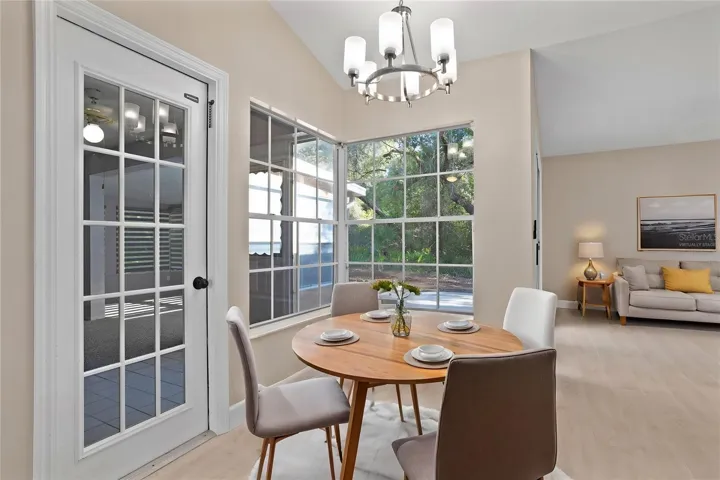 Virtually staged dinette, open to family room