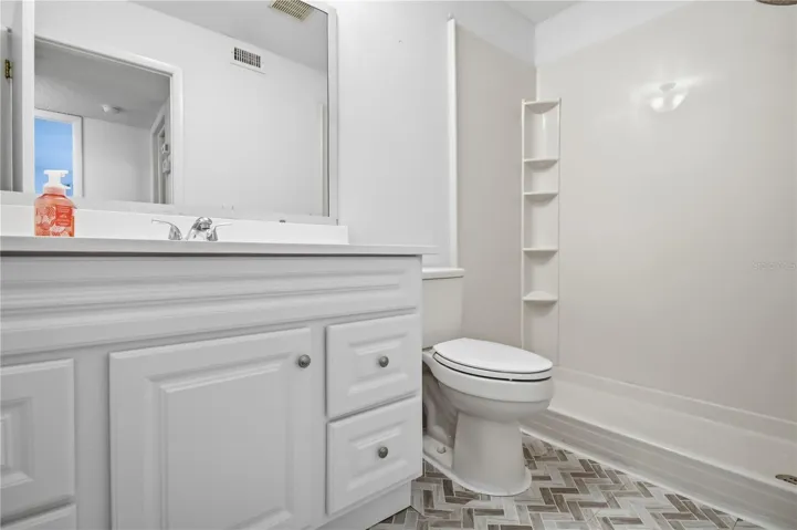 Updated bathroom with newer shower enclosure