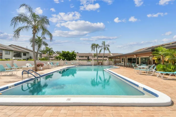 Community pool with spacious sun deck