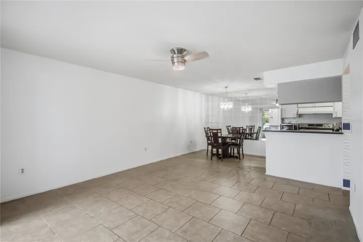 Open living and dining area with kitchen pass through