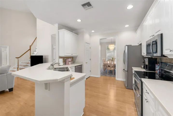 Open Plan with Beautiful Hardwood Floors in Kitchen