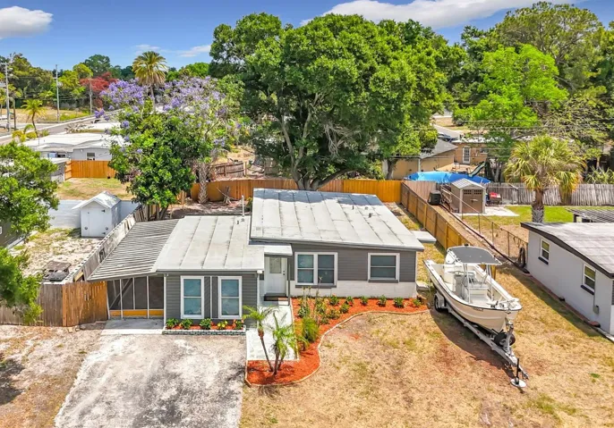 Completely renovated block home offering 4 bedrooms and 2.5 baths, ready for immediate move-in. NEW ROOF (2026) and hot water heater (2026), plus an extended double driveway with ample space for cars, RVs, or boats. NO FLOOD ZONE, NO HOA, NO CDD!