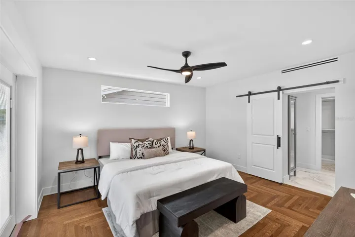 Herringbone hardwood floors in primary