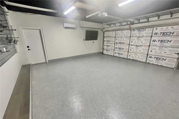 Epoxy floor, insulated garage door, mini split AC unit