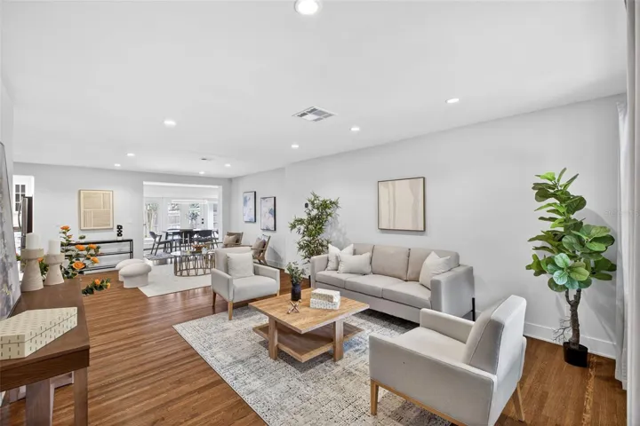 Oversized living room with gleaming original hardwood floors