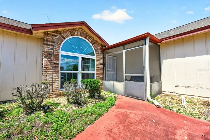 From the moment you arrive, the home stands out with its beautiful architectural details, including a striking ARCHED FRONT WINDOW with brick facing.