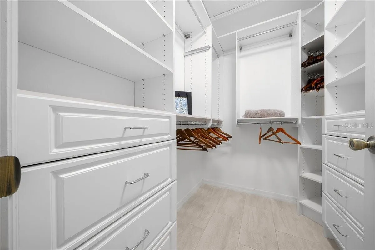 Primary Walk-in Closet w/ Custom Built Shelving