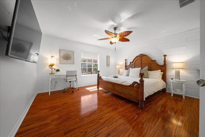 Thoughtfully details, including TV, Desk, & Ceiling Fan