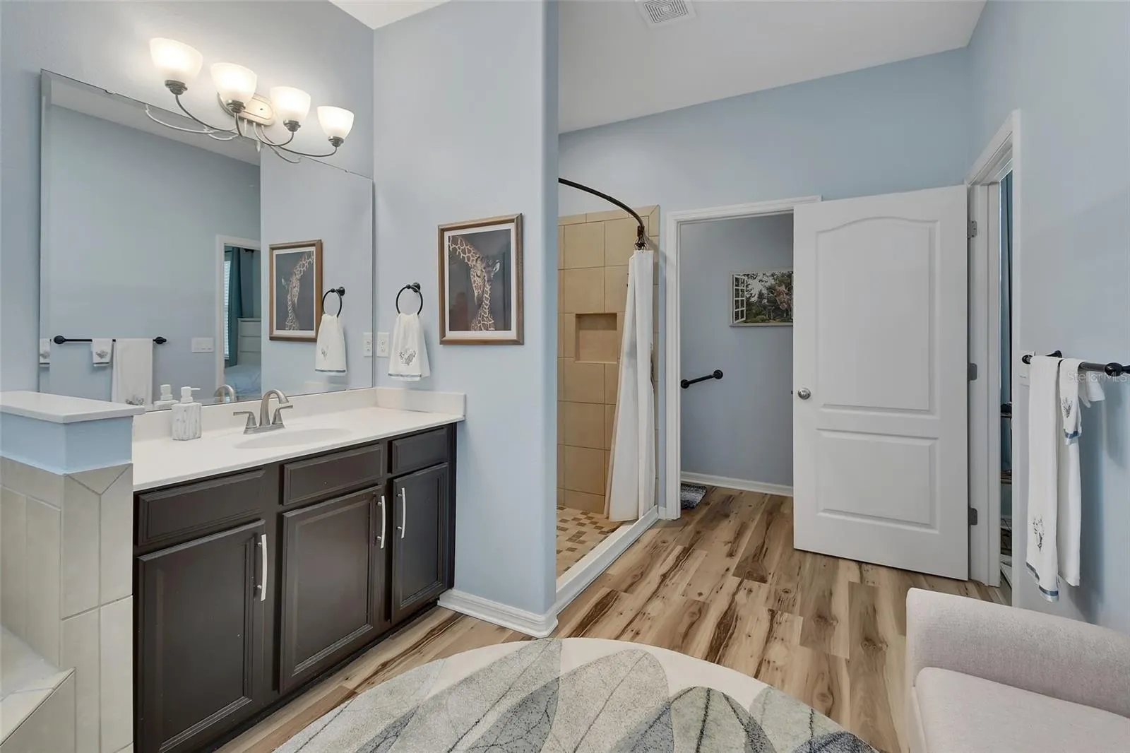 Privacy lavatory with linen closet.