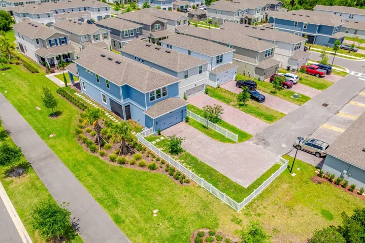 Fenced lot, L shaped driveway and tons of green space.