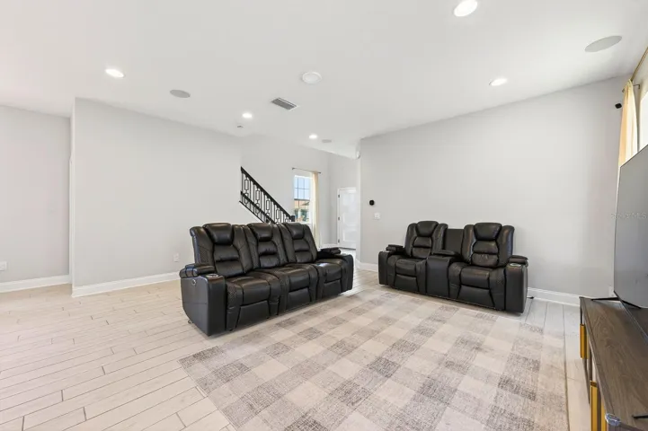 Wood look tile flooring throughout the main level keeps things feeling light and fresh.