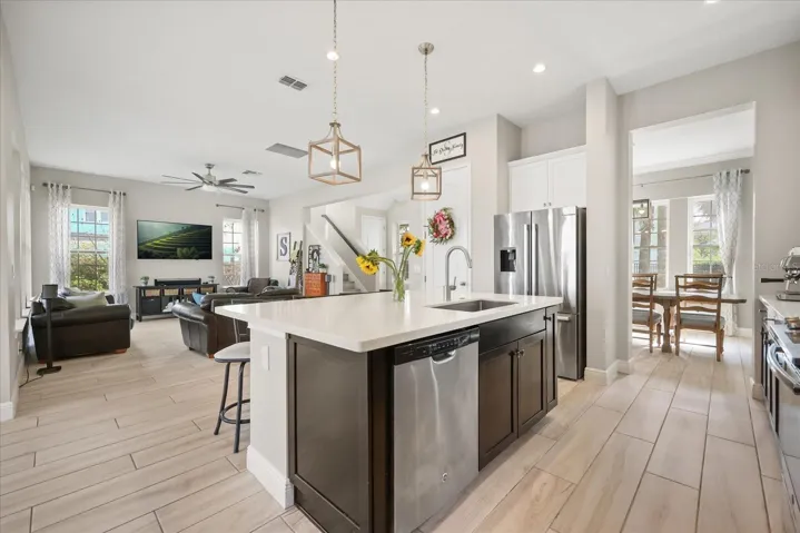 Kitchen with island open to family room