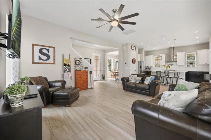 Family room looking to front door/dining room/kitchen