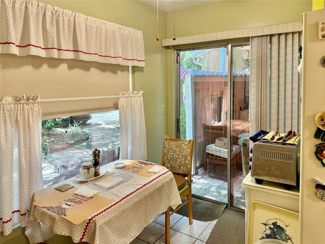 Eat in kitchen with slider to enclosed patio.