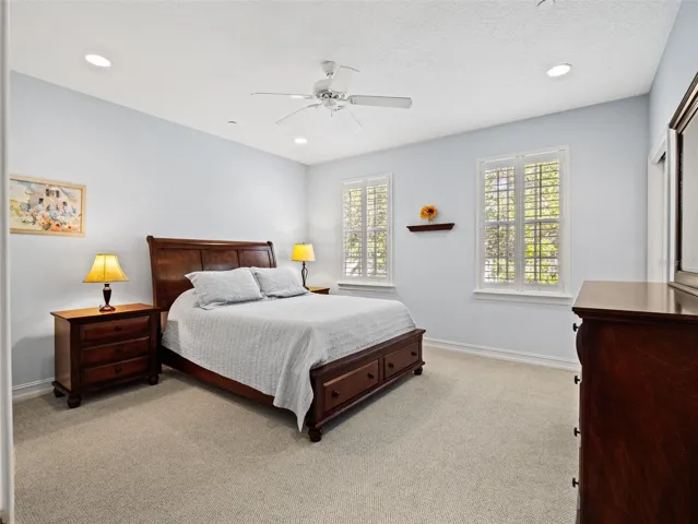 Spacious primary, updated plantation shutters and luxurious carpet.