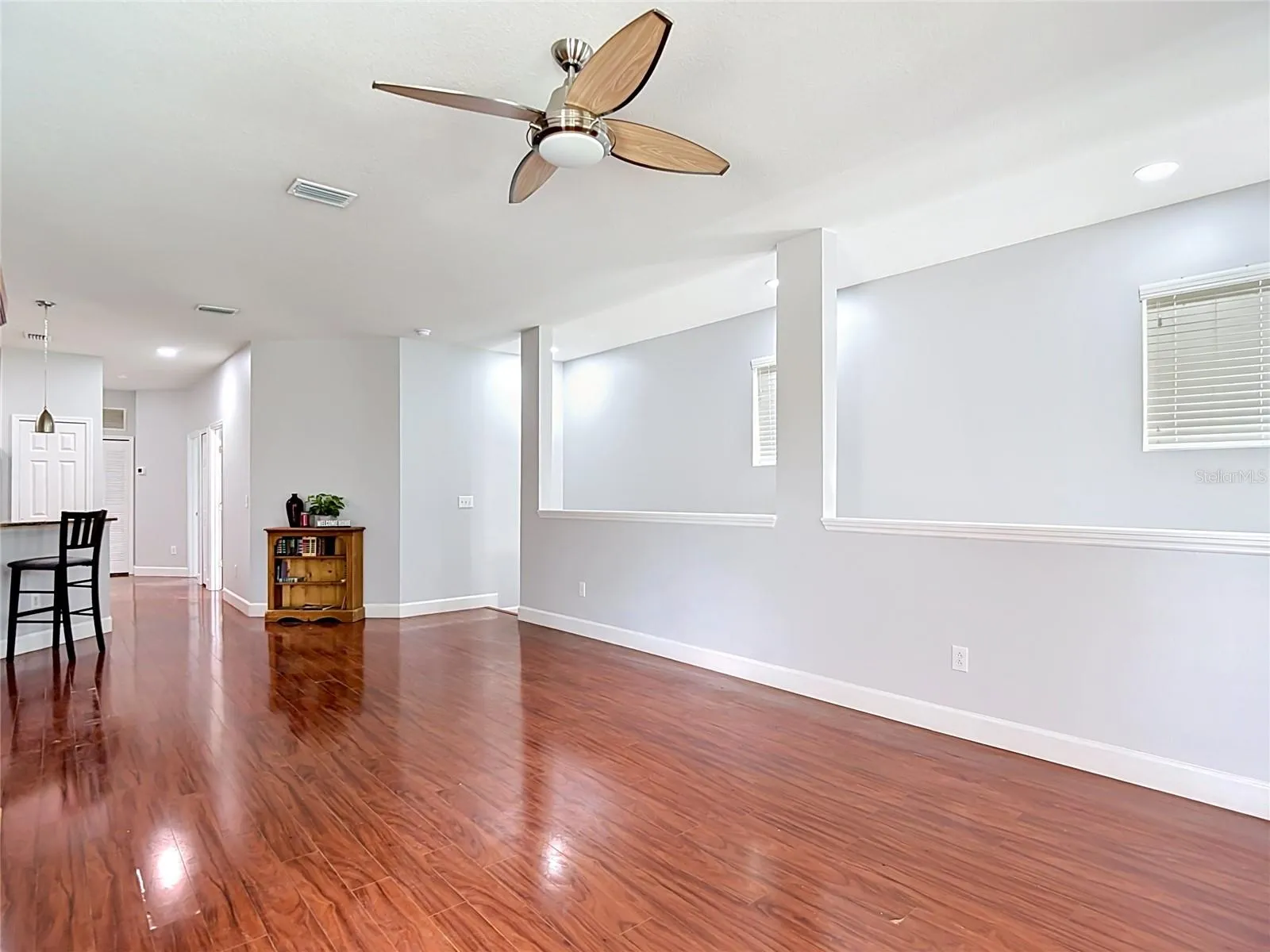 9502 W Park Village 108, Great Room view showing front entry stairwell to right, kitchen to left