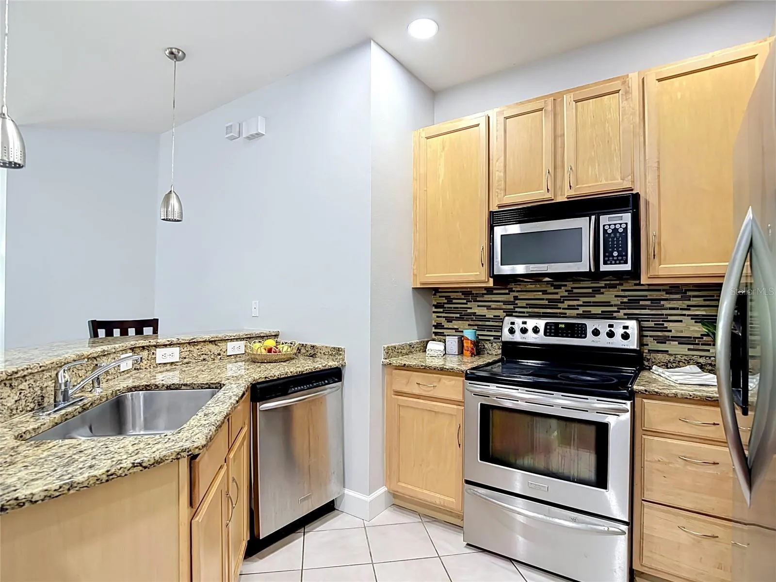 9502 W Park Village 108 Kitchen, dining and great room to left