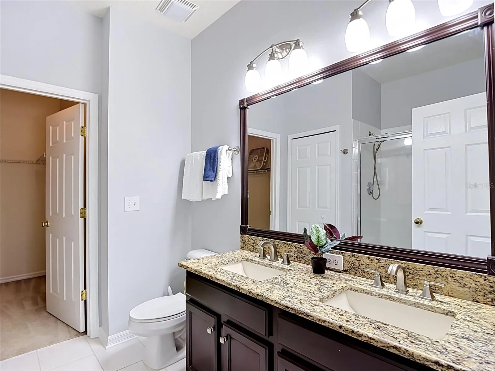9502 W Park Village 108, primary bath, dual sinks, walk in closet to left