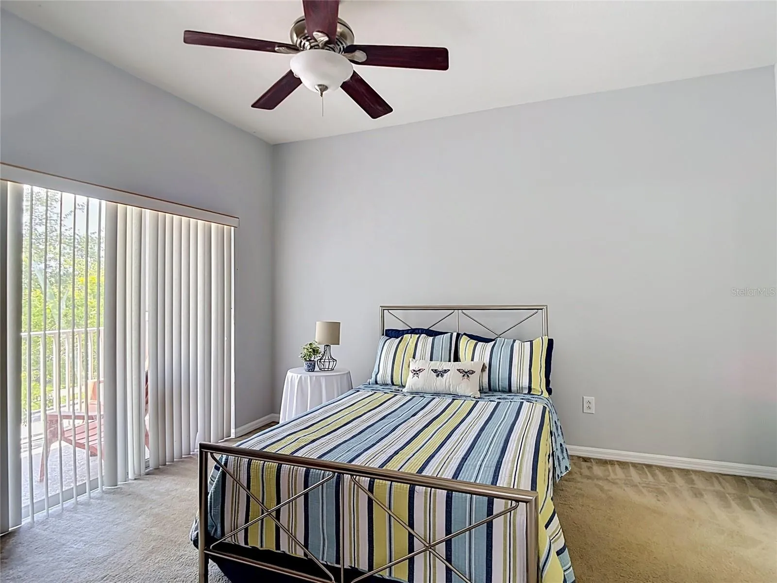 9502 W Park Village 108, primary bedroom, slider to balcony on left