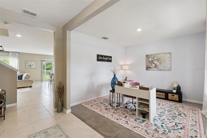 As you enter the front door you're greeted by a flex space to the right currently showcased as an office