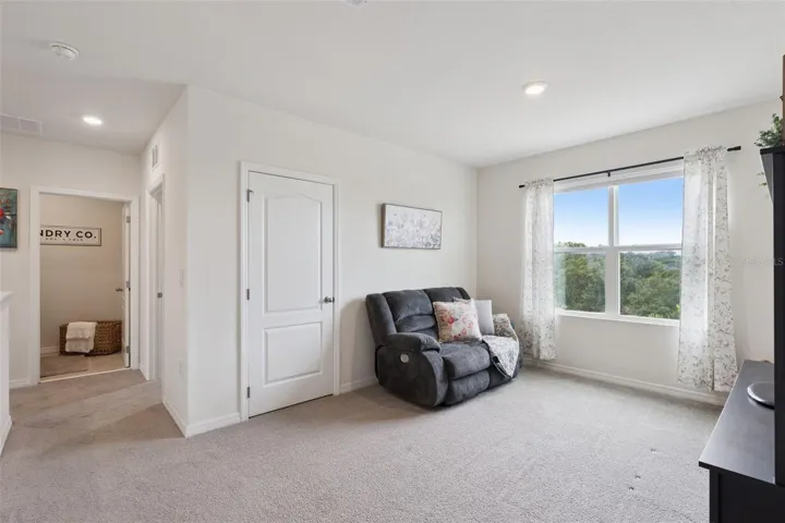 View of the loft and laundry room coming from the 4th and 5th bedroom area