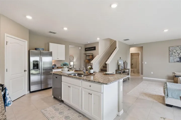 View of kitchen, family room and foyer from the dining are
