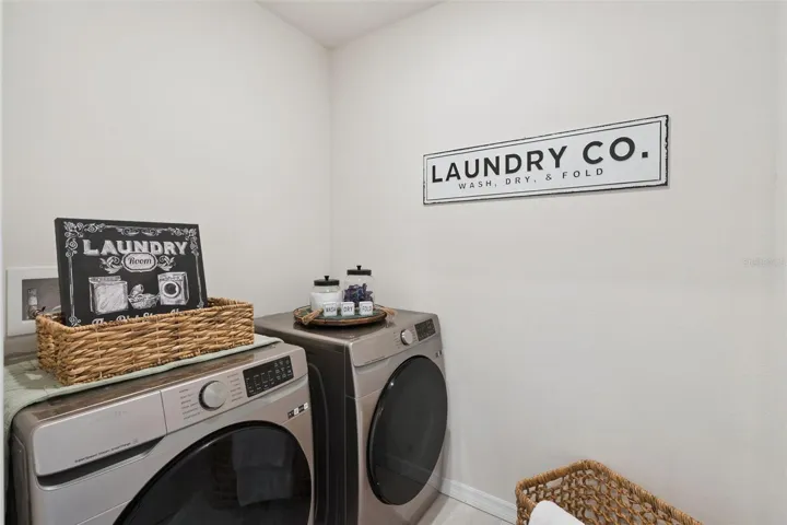 The laundry room can be found upstairs between the owners bedroom and 3rd bedroom