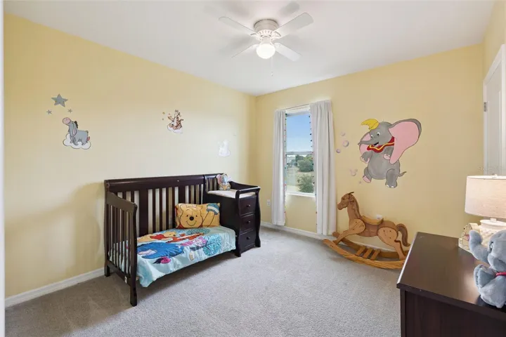 Bedroom 3 overlooks the backyard and is found right off the loft and laundry room