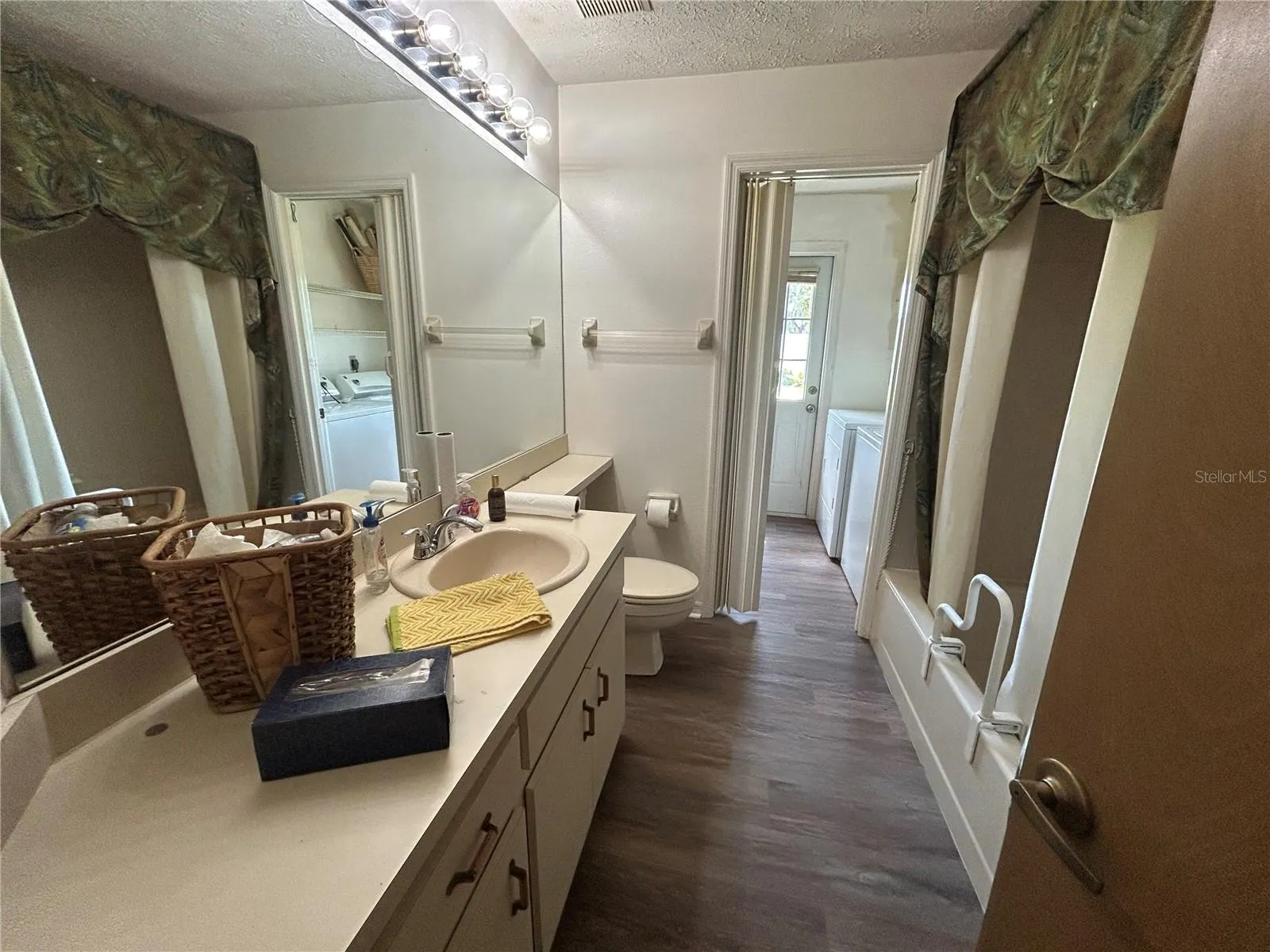 Same bathroom as previous photo but with new flooring