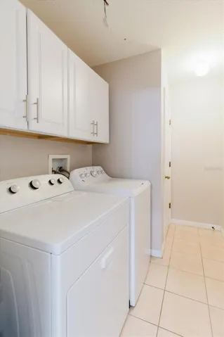 Laundry Room With Washer &amp; Dryer That Conveys