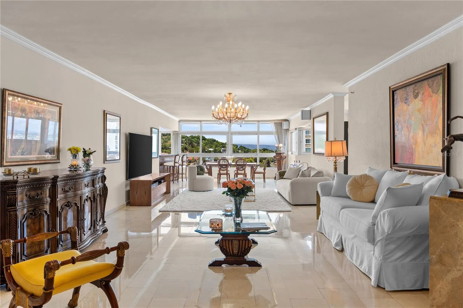 Step inside and you are welcomed by a vast, open living area with stunning mountain views to the west and , to the north, the historic charm of El Morro and the blue ocean. Breathtaking...