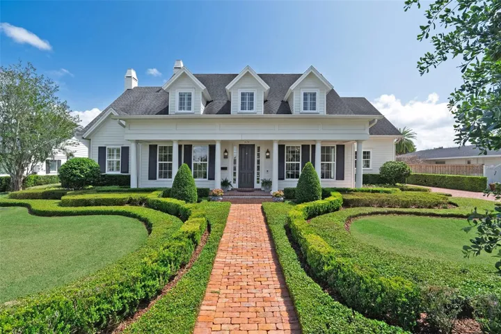 Park Grove Perfection! Southern-inspired residence by esteemed builder Charles Clayton showcases beautifully composed architecture, highlighted by charming dormer windows and a sweeping columned front porch with reclaimed-style brick flooring in a naturally aged finish—creating an inviting first impression!