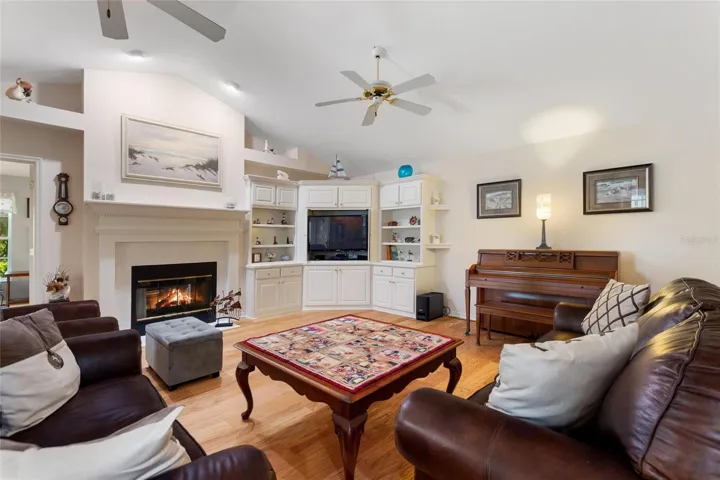 Family Room with Double Sided Fireplace to Florida Room. Built Ins