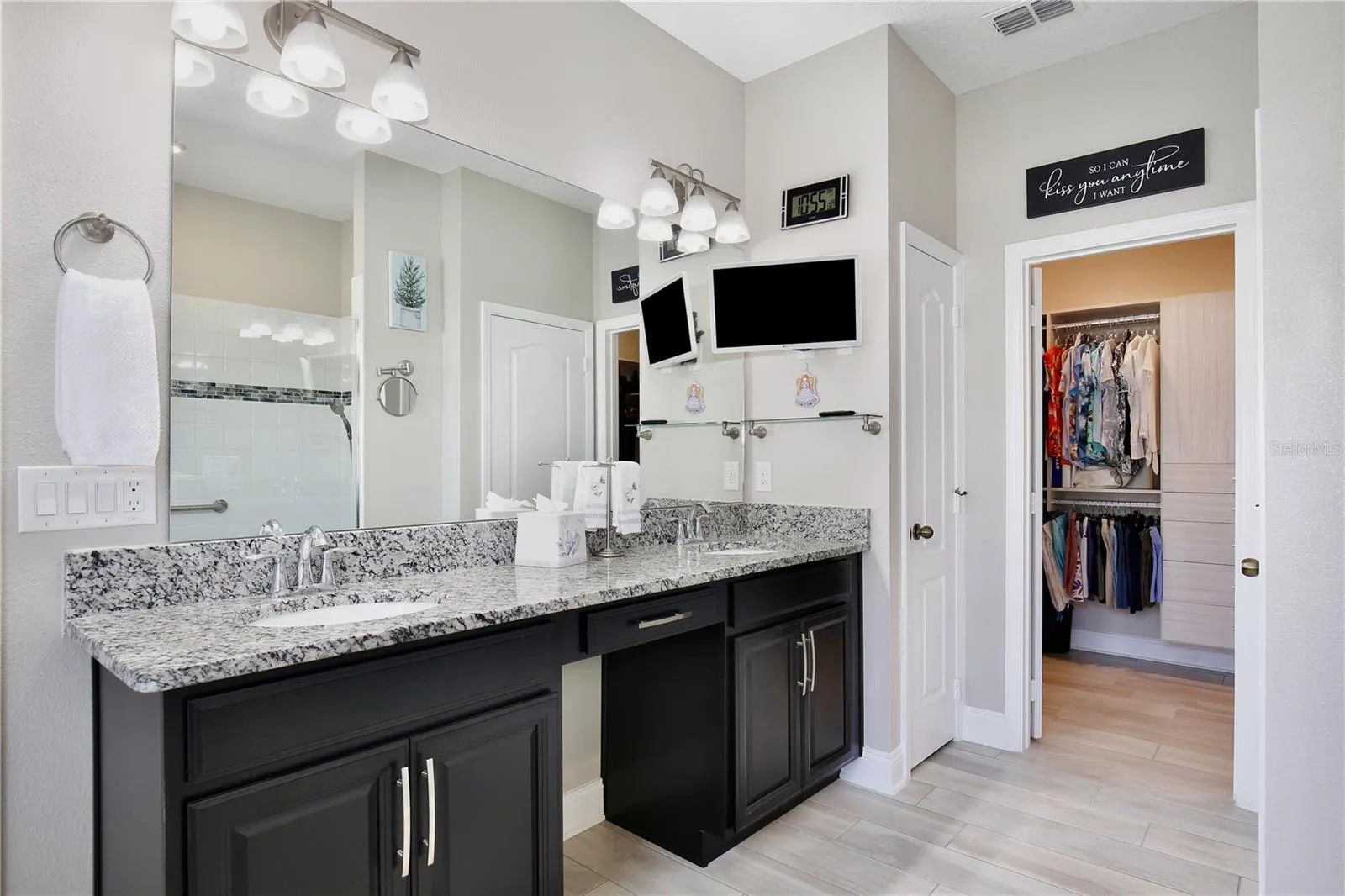 DUAL SINKS WITH VANITY SPACE IN PRIMARY BATHROOM