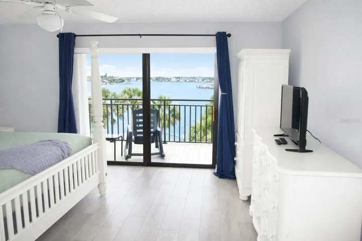 Primary Bedroom with entrance to balcony.