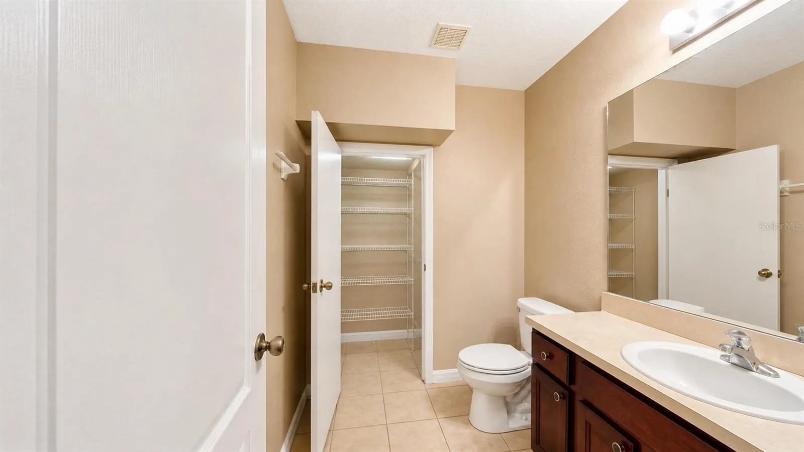 Half bathroom with extra storage on the first floor.